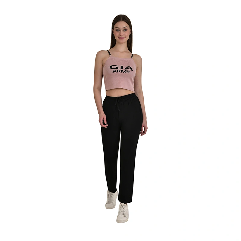 Female model in black jogger pants and crop top - western wear ecommerce photography by Lohar Studio Delhi